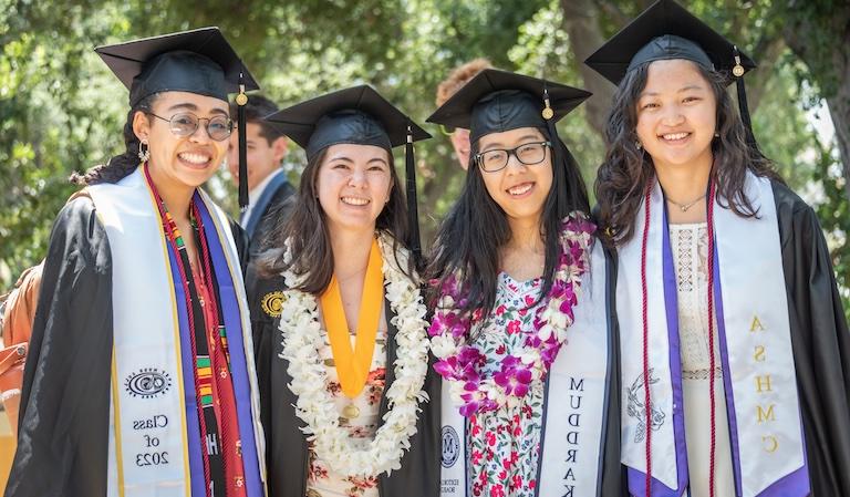 Four graduations in robes